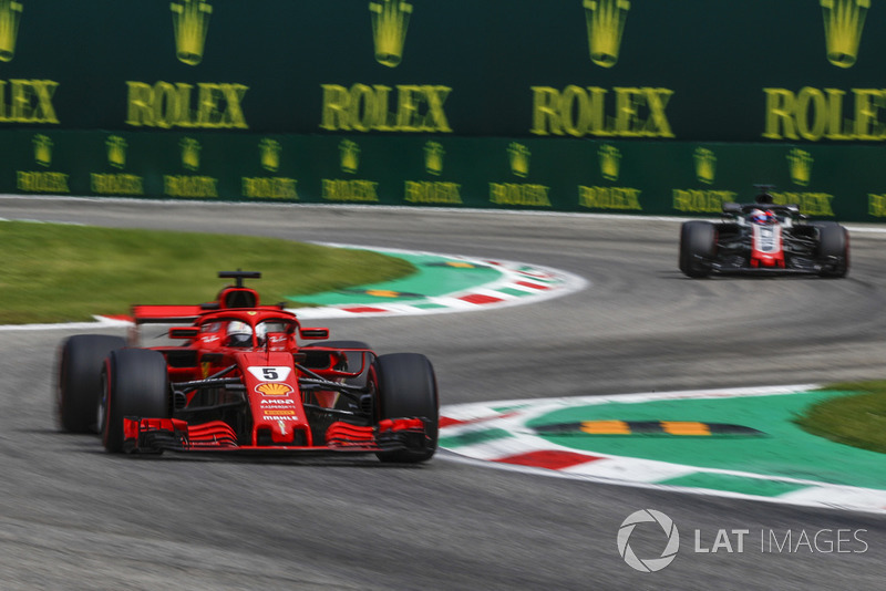 Sebastian Vettel, Ferrari SF71H and Romain Grosjean, Haas F1 Team VF-18