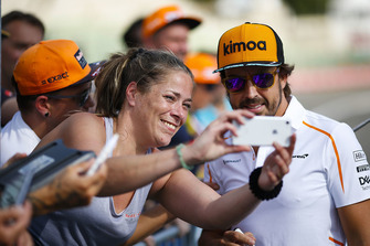Fernando Alonso, McLaren, has his picture taken by a fan