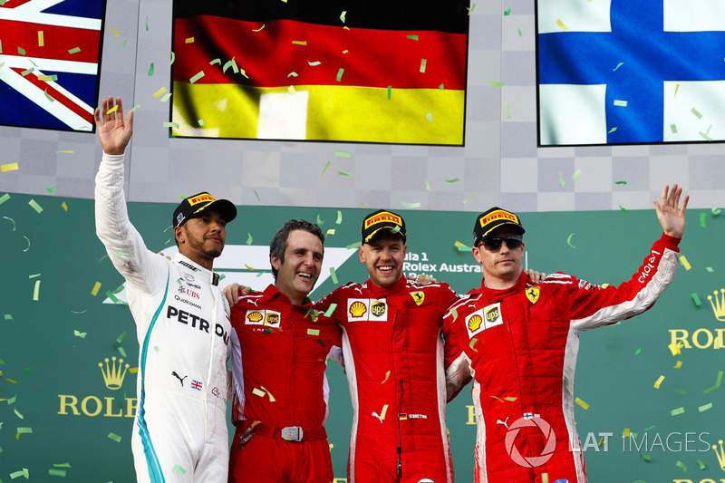 Lewis Hamilton, Mercedes AMG F1, 2nd position, Inaki Rueda, Race Strategist, Ferrari, Sebastian Vettel, Ferrari, 1st position, and Kimi Raikkonen, Ferrari, 3rd position, on the podium