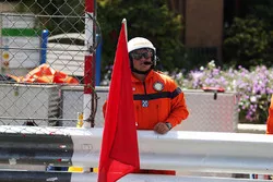 Marshal with a red flag
