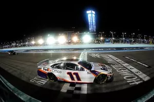 Denny Hamlin, Joe Gibbs Racing, Toyota Camry crosses the finish line