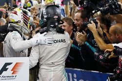 Nico Rosberg, Mercedes AMG F1, celebrates in Parc Ferme after finishing in second position and winning the championship with team mate Lewis Hamilton, Mercedes AMG F1