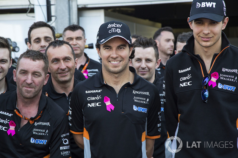 Sergio Perez, Force India, Esteban Ocon, Force India F1 and the team mechanics at the reveal of the the Breast Cancer Care partnership with Force India F1