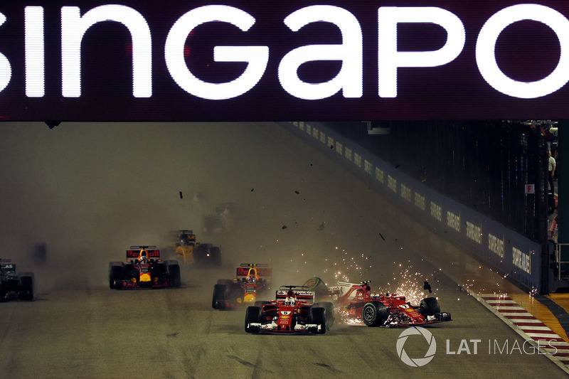 Sebastian Vettel, Ferrari SF70H leads at the start of the race and the cars of Kimi Raikkonen, Ferrari SF70H and Max Verstappen, Red Bull Racing RB13 crash after colliding