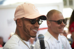 Lewis Hamilton, Mercedes AMG F1, and Valtteri Bottas, Mercedes AMG F1 on stage