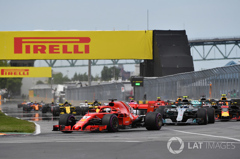 Sebastian Vettel, Ferrari SF71H leads at the start of the race