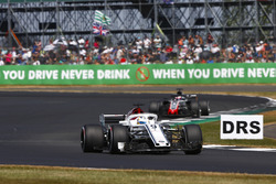 Marcus Ericsson, Sauber C37, leads Romain Grosjean, Haas F1 Team VF-18