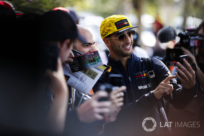 Daniel Ricciardo, Red Bull Racing, takes a picture for fans