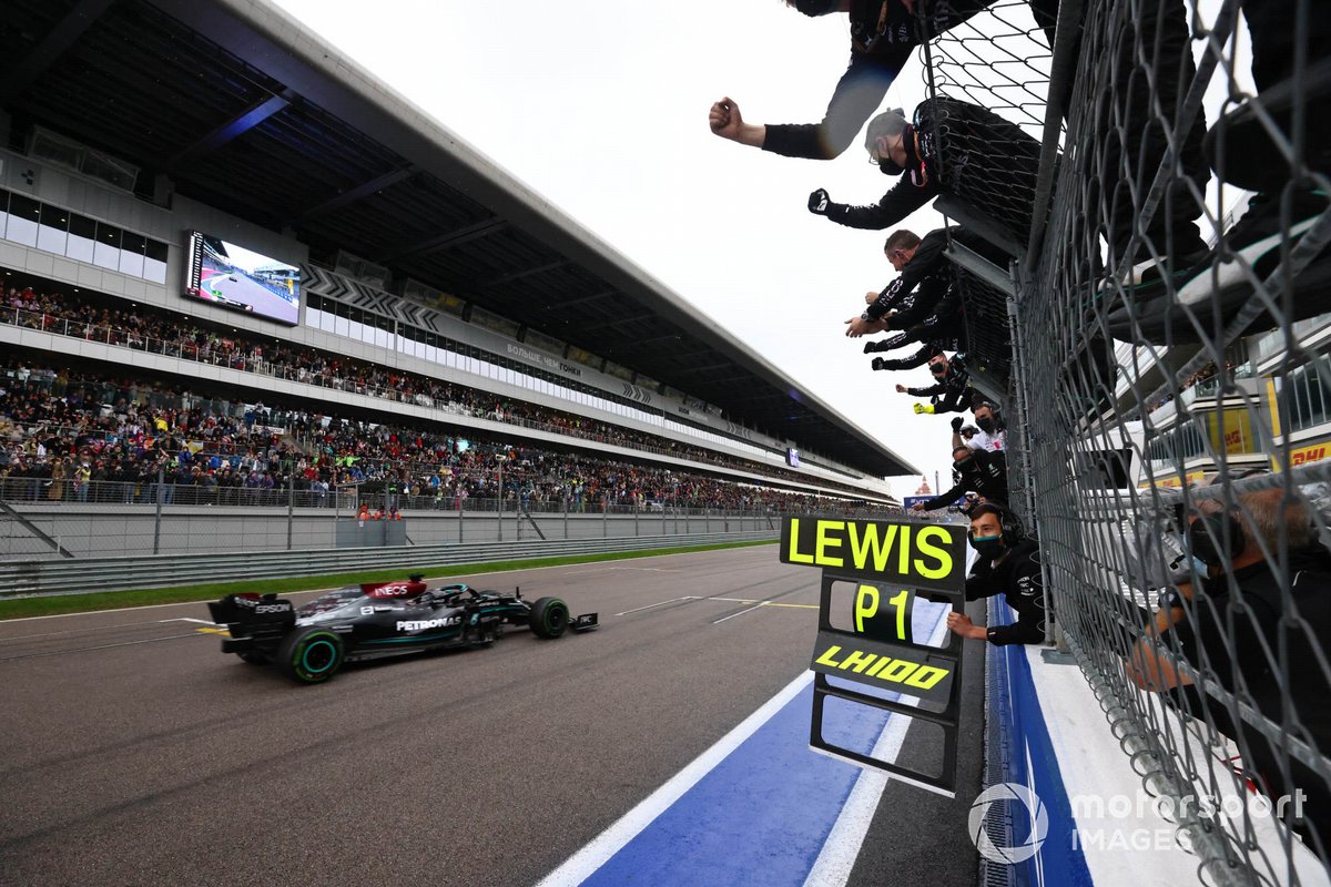 Lewis Hamilton, Mercedes W12, 1st position, takes victory to the delight of his team on the pit wall