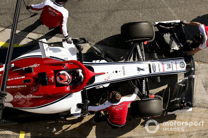 Kimi Raikkonen, Alfa Romeo Racing, stops in his pit area