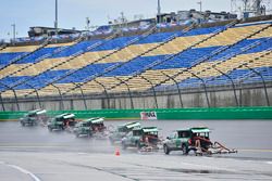 Track workers attempt to dry the track