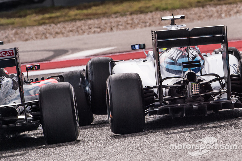 Fernando Alonso, McLaren MP4-31 and Felipe Massa, Williams FW38 touch wheels