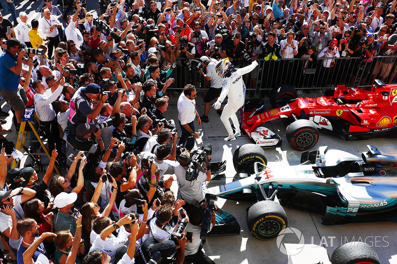 Lewis Hamilton, Mercedes AMG F1 W08, jumps from his car in Parc Ferme after winning the race