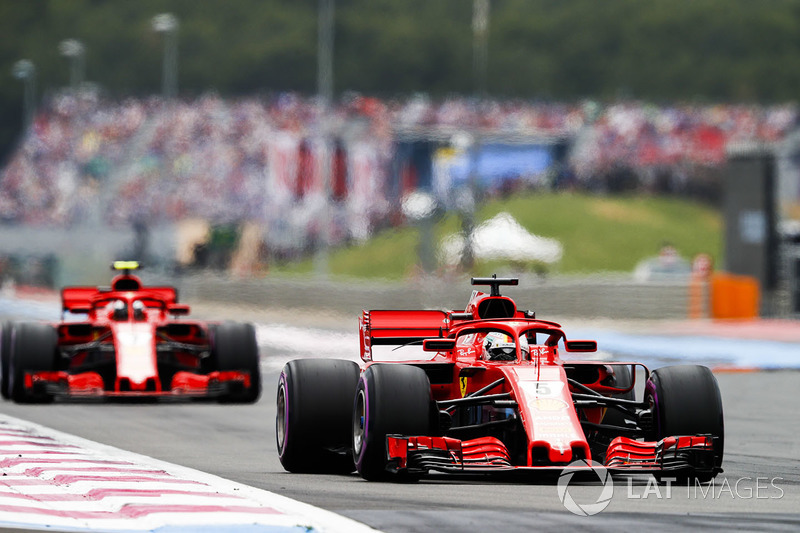 Sebastian Vettel, Ferrari SF71H, leads Kimi Raikkonen, Ferrari SF71H