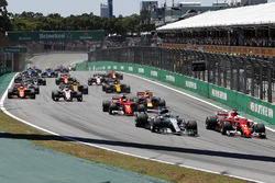 Valtteri Bottas, Mercedes-Benz F1 W08 and Sebastian Vettel, Ferrari SF70H battle at the start of th