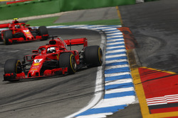 Sebastian Vettel, Ferrari SF71H, leads Kimi Raikkonen, Ferrari SF71H