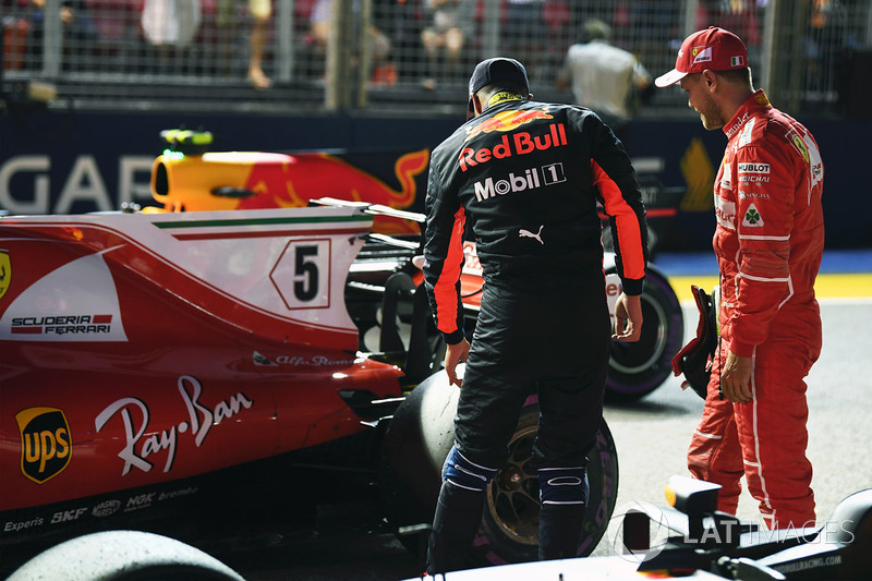 Daniel Ricciardo, Red Bull Racing RB13 and Sebastian Vettel, Ferrari SF70H in parc ferme