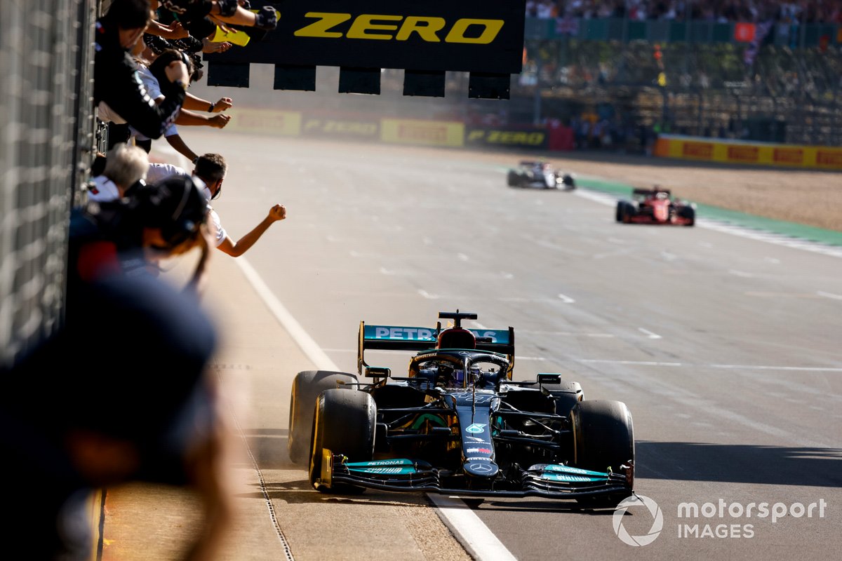 Race Winner Lewis Hamilton, Mercedes W12 crosses the finish line