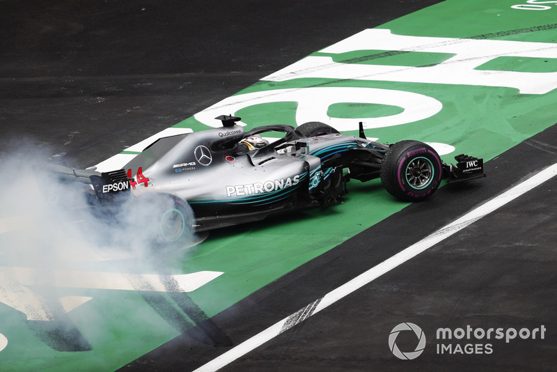 Lewis Hamilton, Mercedes AMG F1 W09 EQ Power+, performs a doughnut as he celebrates winning his fifth World Championship