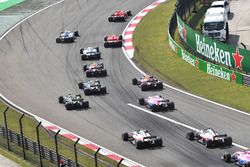 Sebastian Vettel, Ferrari SF71H and Kimi Raikkonen, Ferrari SF71H lead at the start of the race
