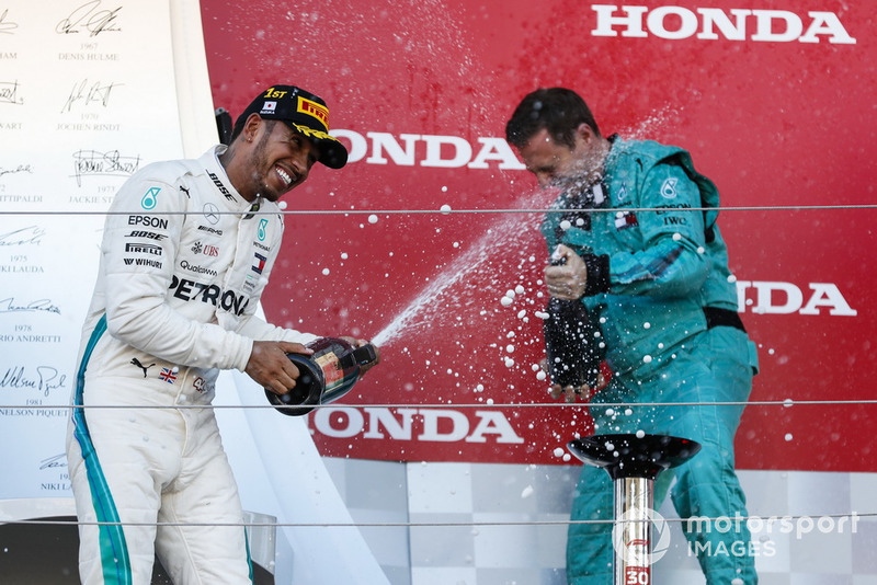 Race winner Lewis Hamilton, Mercedes AMG F1, sprays Champagne on the podium