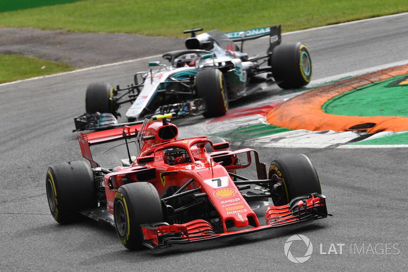 Kimi Raikkonen, Ferrari SF71H leads Lewis Hamilton, Mercedes AMG F1 W09