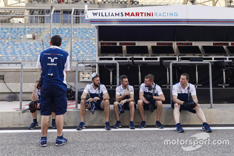 Williams team members in the pit lane