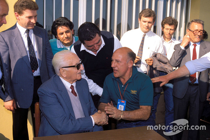 Modena 1987, Enzo Ferrari with Stirling Moss, during the Mille Miglia veterans parade at the Scaglietti factory