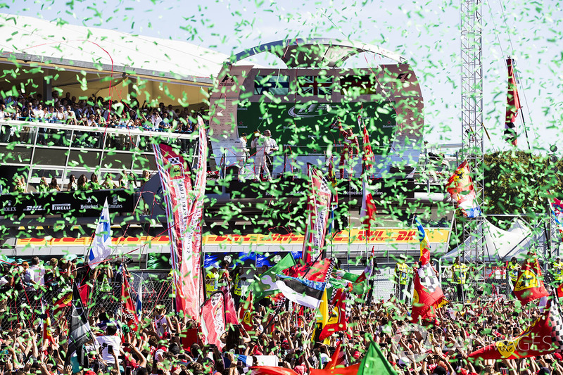 Confetti falls as Race winner Lewis Hamilton, Mercedes AMG F1, Second place Third place Valtteri Bottas, Mercedes AMG F1 Sebastian Vettel, Ferrari, celebrate on the podium