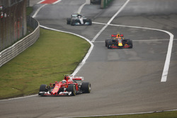 Kimi Raikkonen, Ferrari SF70H, leads Max Verstappen, Red Bull Racing RB13 and Valtteri Bottas, Mercedes AMG F1 W08