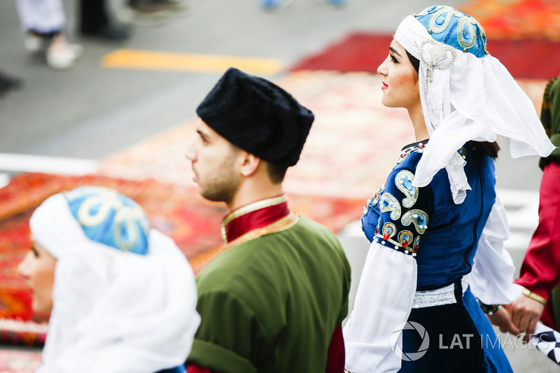 Entertainers in traditional costume on the grid