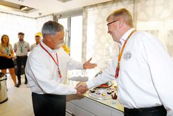 Chase Carey, Chairman, Formula One, greets Ross Brawn, Managing Director of Motorsports, FOM