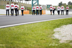 Marcus Ericsson, Sauber, walks the circuit alongside colleagues, including team-mate Charles Leclerc, Sauber