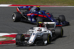 Charles Leclerc, Sauber C37 Ferrari, leads Pierre Gasly, Toro Rosso STR13 Honda