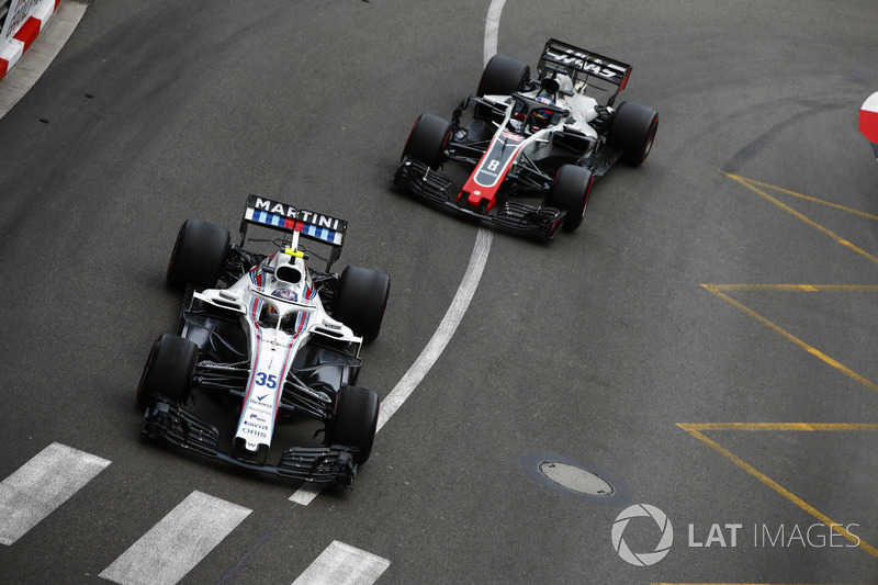 Sergey Sirotkin, Williams FW41, leads Romain Grosjean, Haas F1 Team VF-18