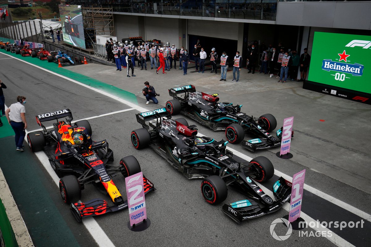 Pole man Lewis Hamilton, Mercedes W12, Valtteri Bottas, Mercedes W12, and Max Verstappen, Red Bull Racing RB16B, arrive in Parc Ferme after Qualifying