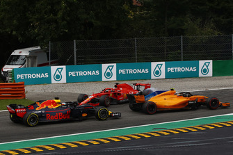 Sebastian Vettel, Ferrari SF71H lighting up his tyres after making contact with Lewis Hamilton, Mercedes AMG F1 W09 while Stoffel Vandoorne, McLaren MCL33 and Daniel Ricciardo, Red Bull Racing RB14 drive past