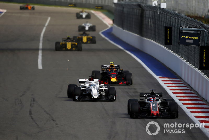 Romain Grosjean, Haas F1 Team VF-18 leads Marcus Ericsson, Sauber C37