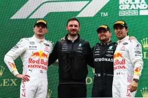 Max Verstappen, Red Bull Racing, 2nd position, the Mercedes trophy delegate, Valtteri Bottas, Mercedes, 1st position, and Sergio Perez, Red Bull Racing, 3rd position, on the podium