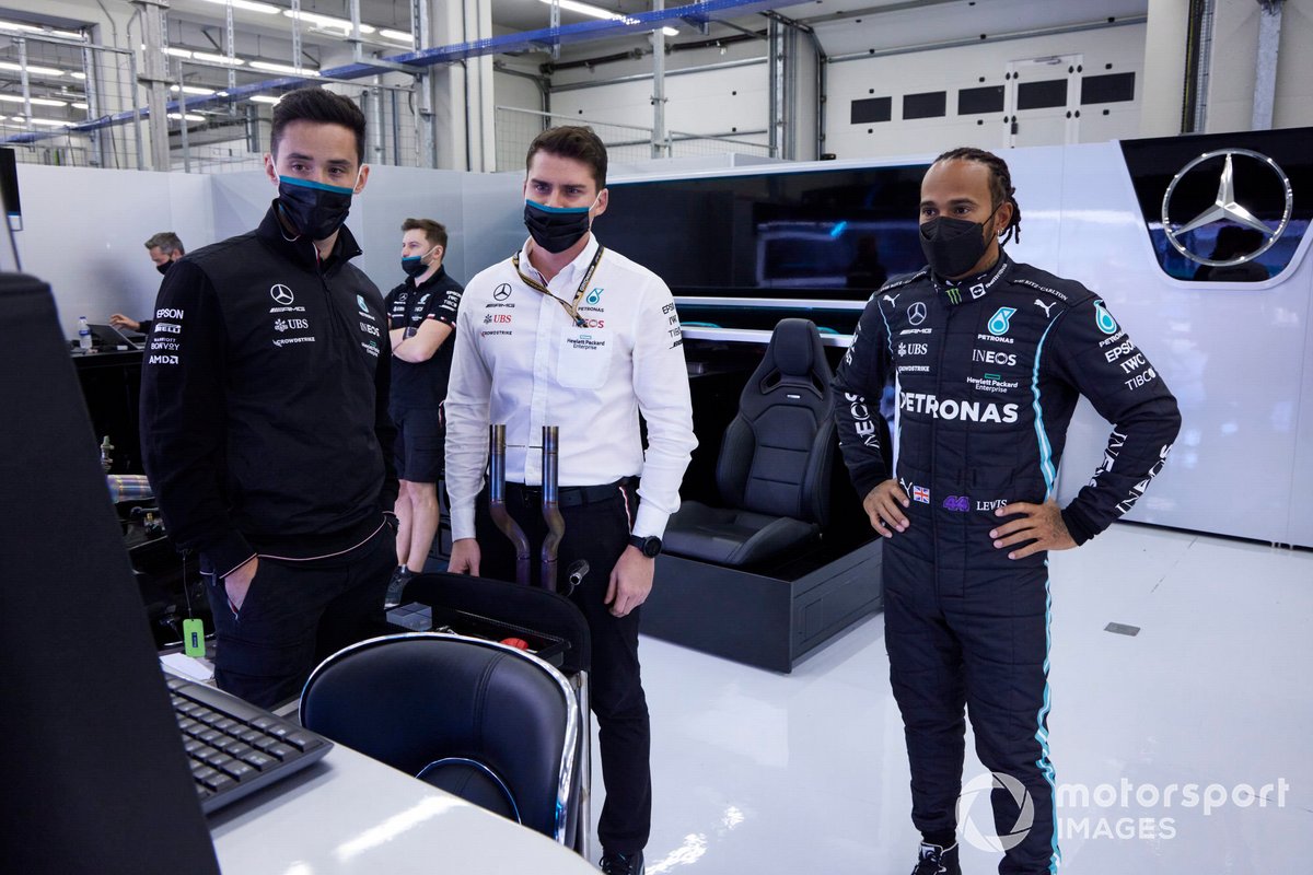 Lewis Hamilton, Mercedes, talks with members of his team