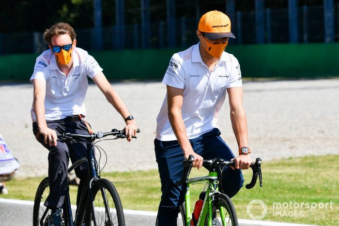 Lando Norris, McLaren, cycles the track