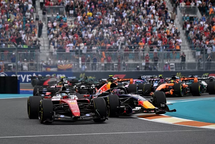 Charles Leclerc, Ferrari; Max Verstappen, Red Bull Racing