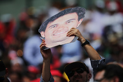 A fan with a Sergio Perez, Sahara Force India F1 cut out head
