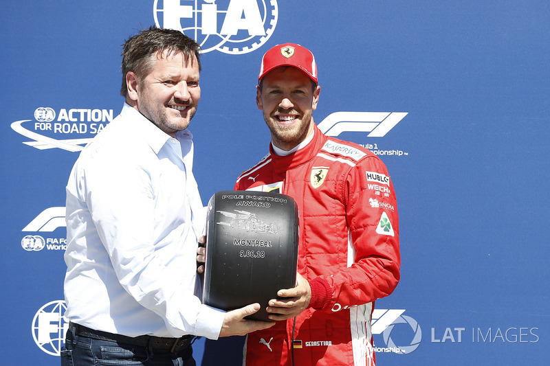 Sebastian Vettel, Ferrari receives the Pirelli Pole Position award from Paul Hembery, Pirelli Motors