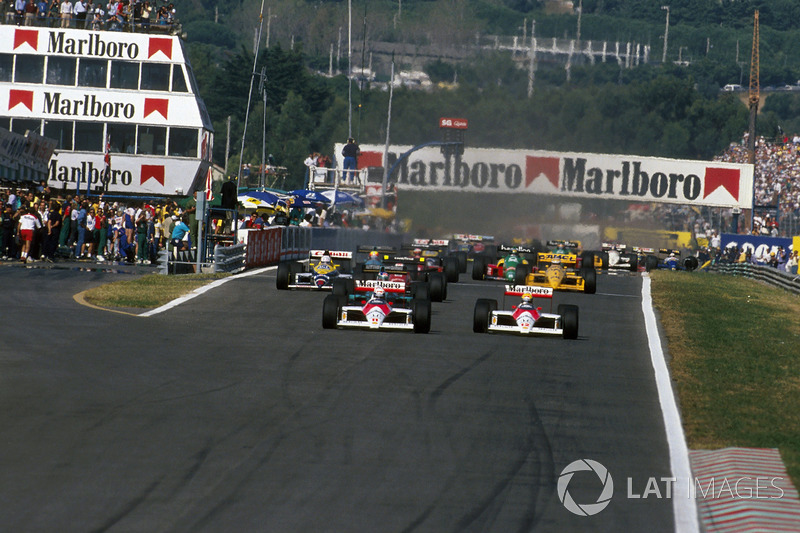 Alain Prost, McLaren MP4/4 leads teammate Ayrton Senna, McLaren MP4/4 and Ivan Capelli, March 881 at the start