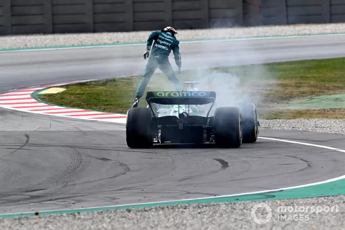 Sebastian Vettel, Aston Martin AMR22, stops with a technical failure resulting in smoke