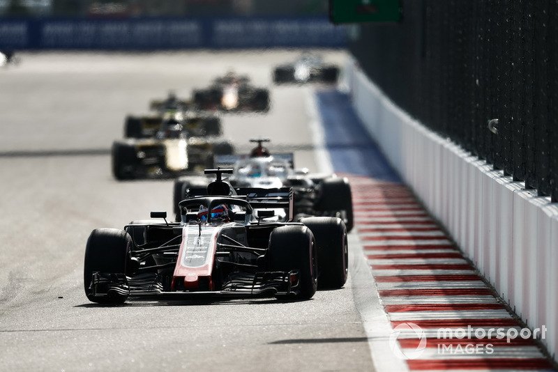 Romain Grosjean, Haas F1 Team VF-18, leads Marcus Ericsson, Sauber C37