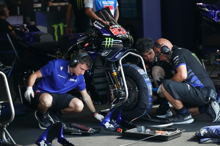 The Factory Yamaha mechanics prepare the bikes.