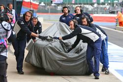 The Sauber C35 of Marcus Ericsson, Sauber F1 Team is recovered back to the pits