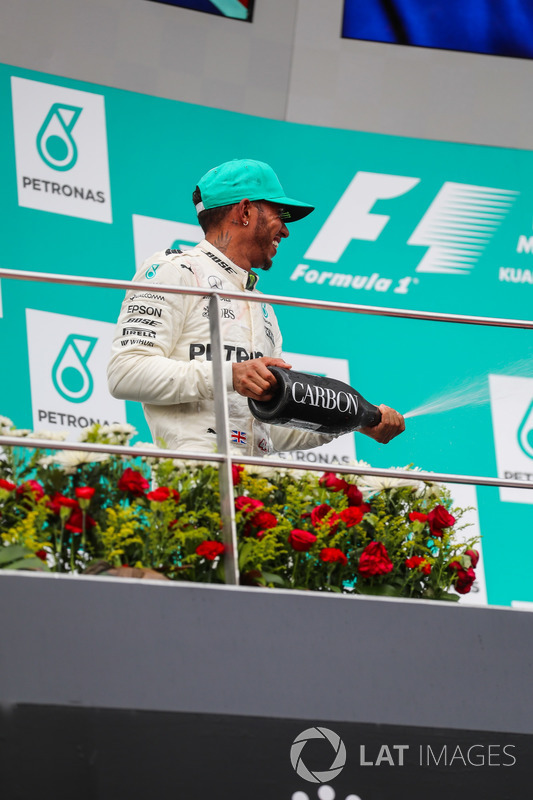 Lewis Hamilton, Mercedes AMG F1 celebrates on the podium, the champagne